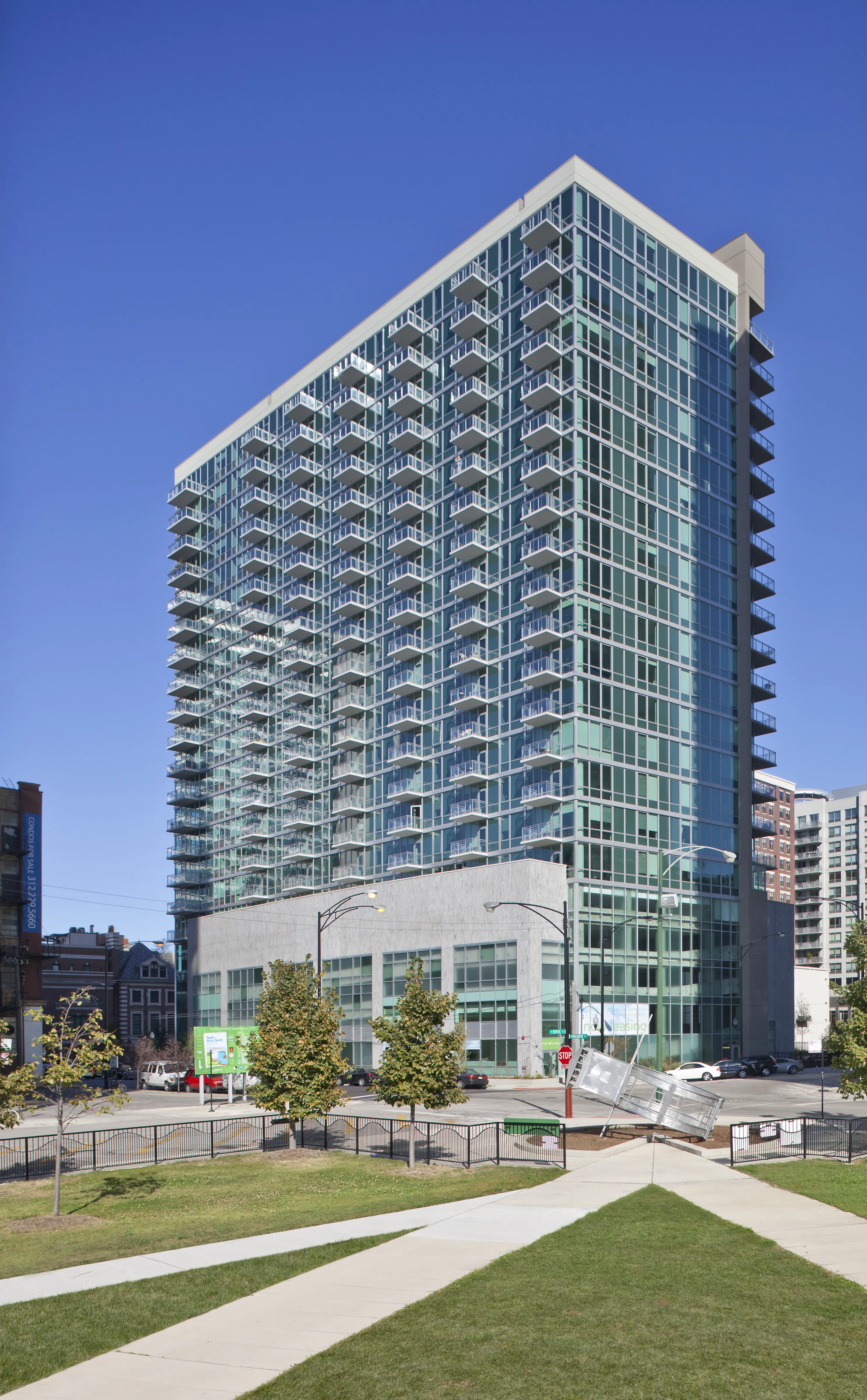 Elegant hardwood flooring, designer pendant lighting and custom cabinetry stand o