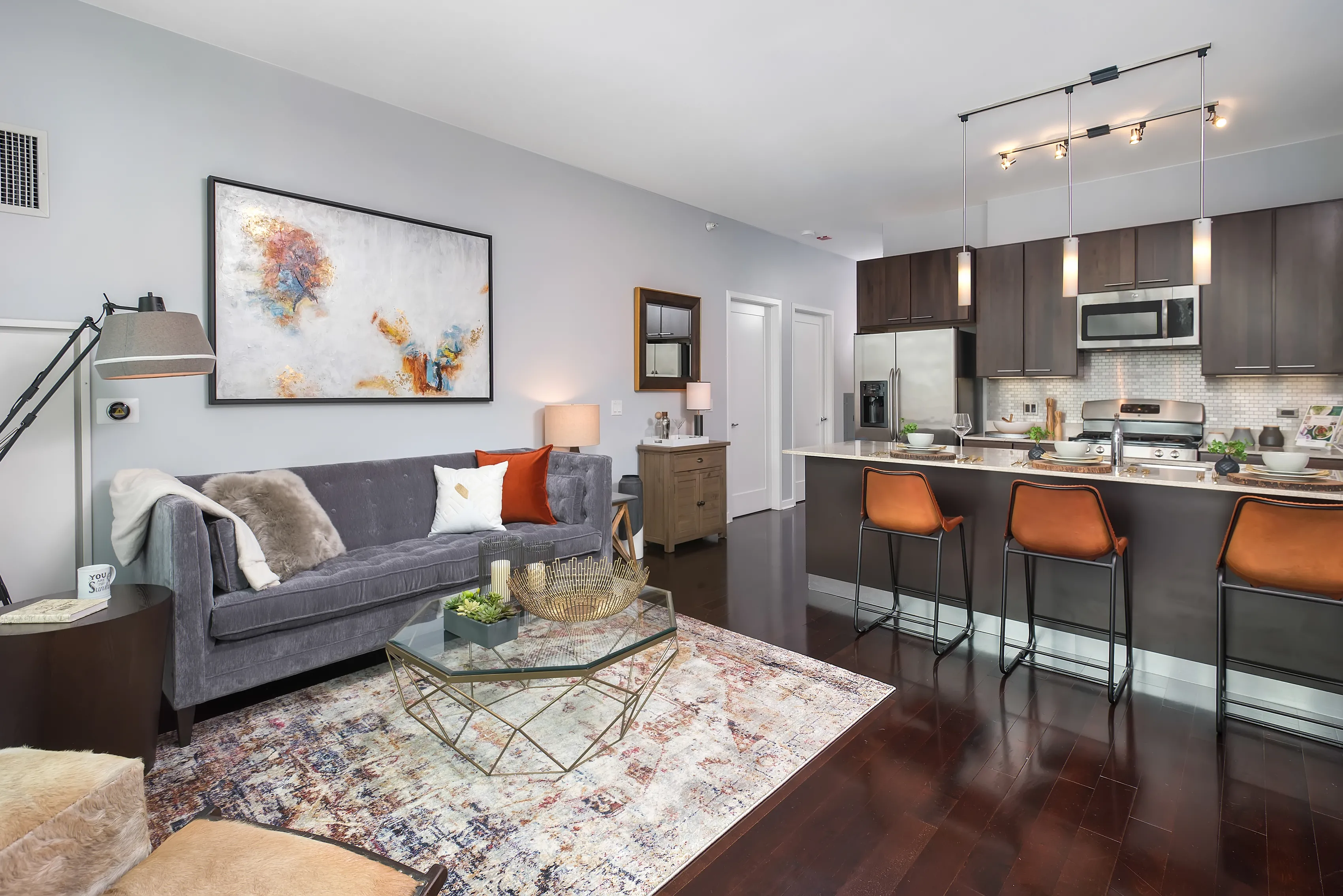 living room and kitchen island at Parc Huron Apartments in Chicago