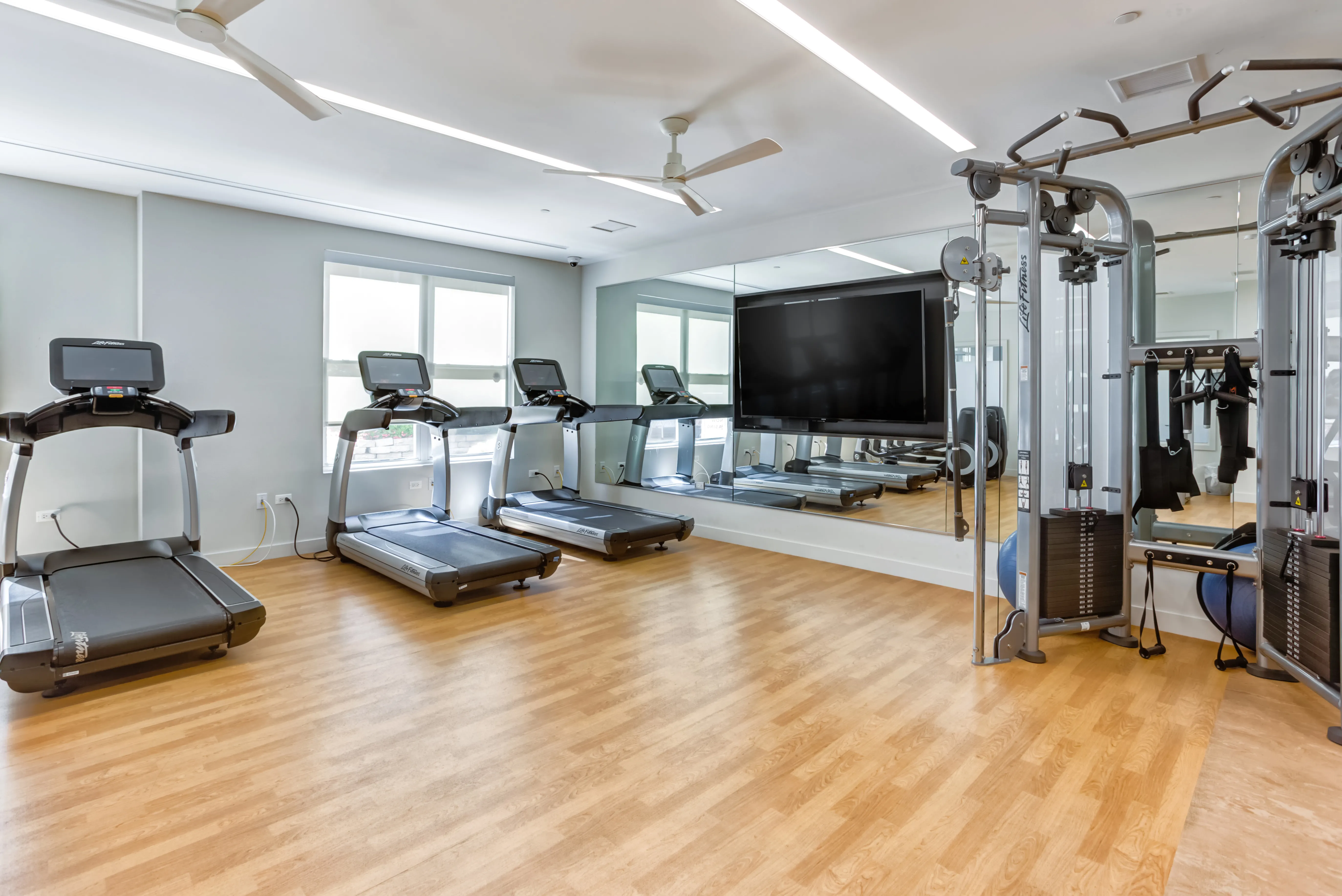 treadmills in fitness area at Reserve at Evanston Apartments