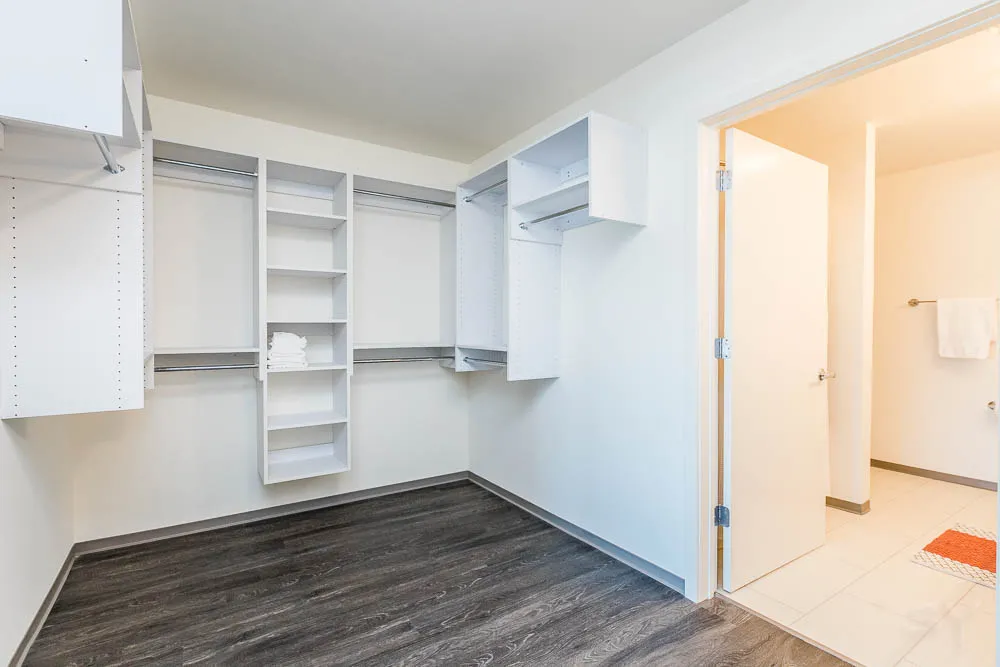 kitchena nd living area with wood floors at The Western 1920 Apartments
