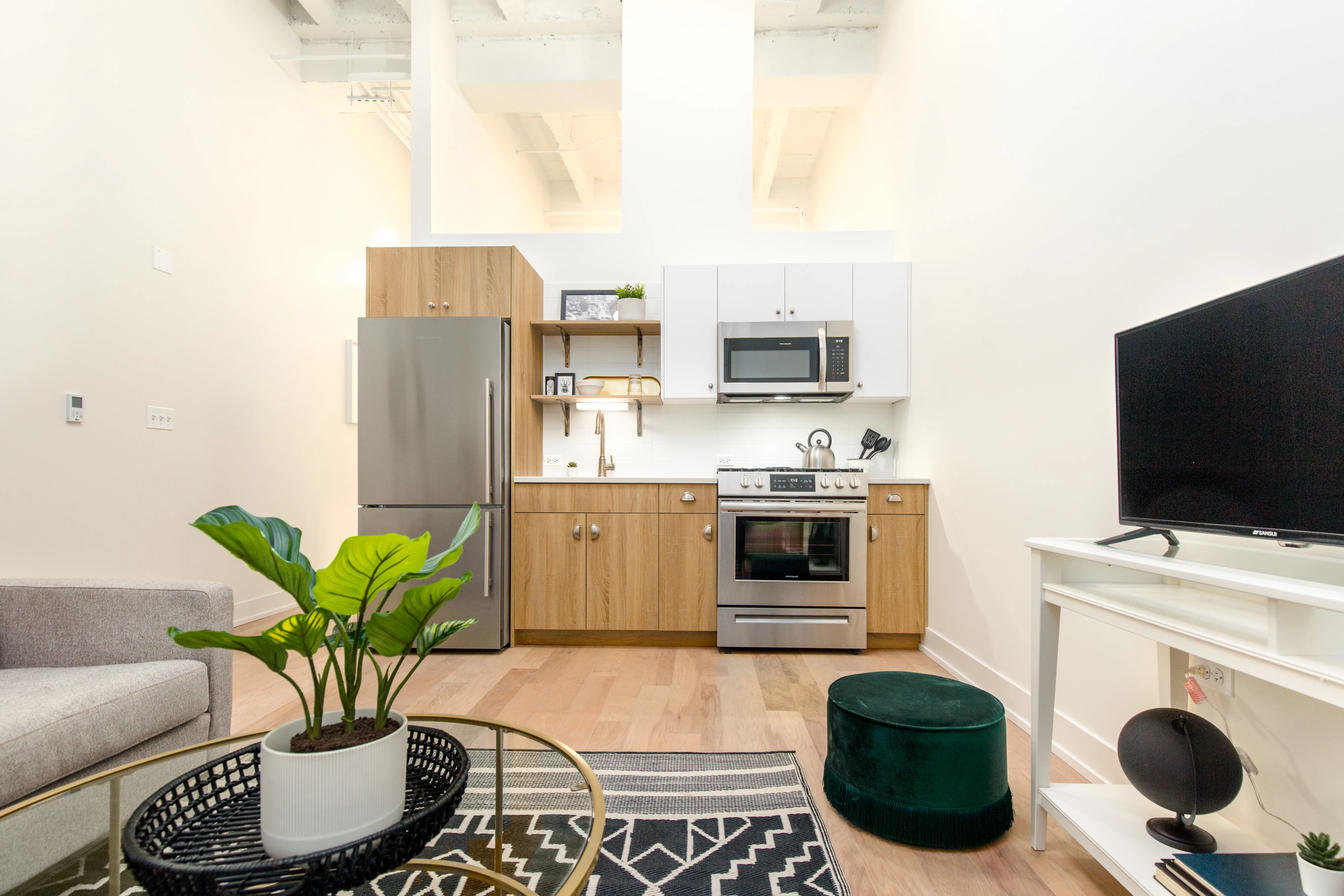 living room with grey sofa and hardwood floors in Chicago Loop apartment