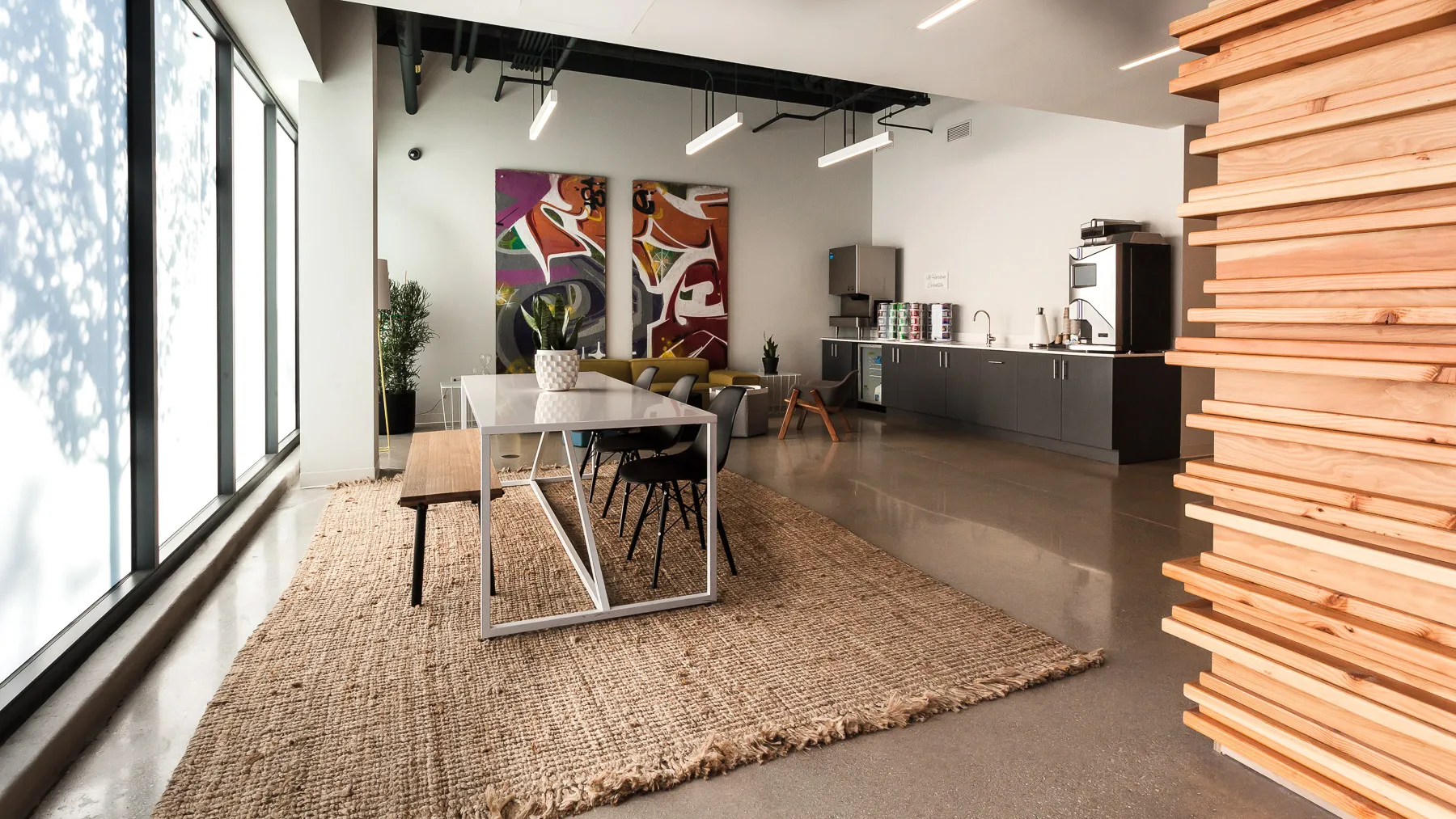 outdoor amenity area with El train car at L - Logan Square Apartments