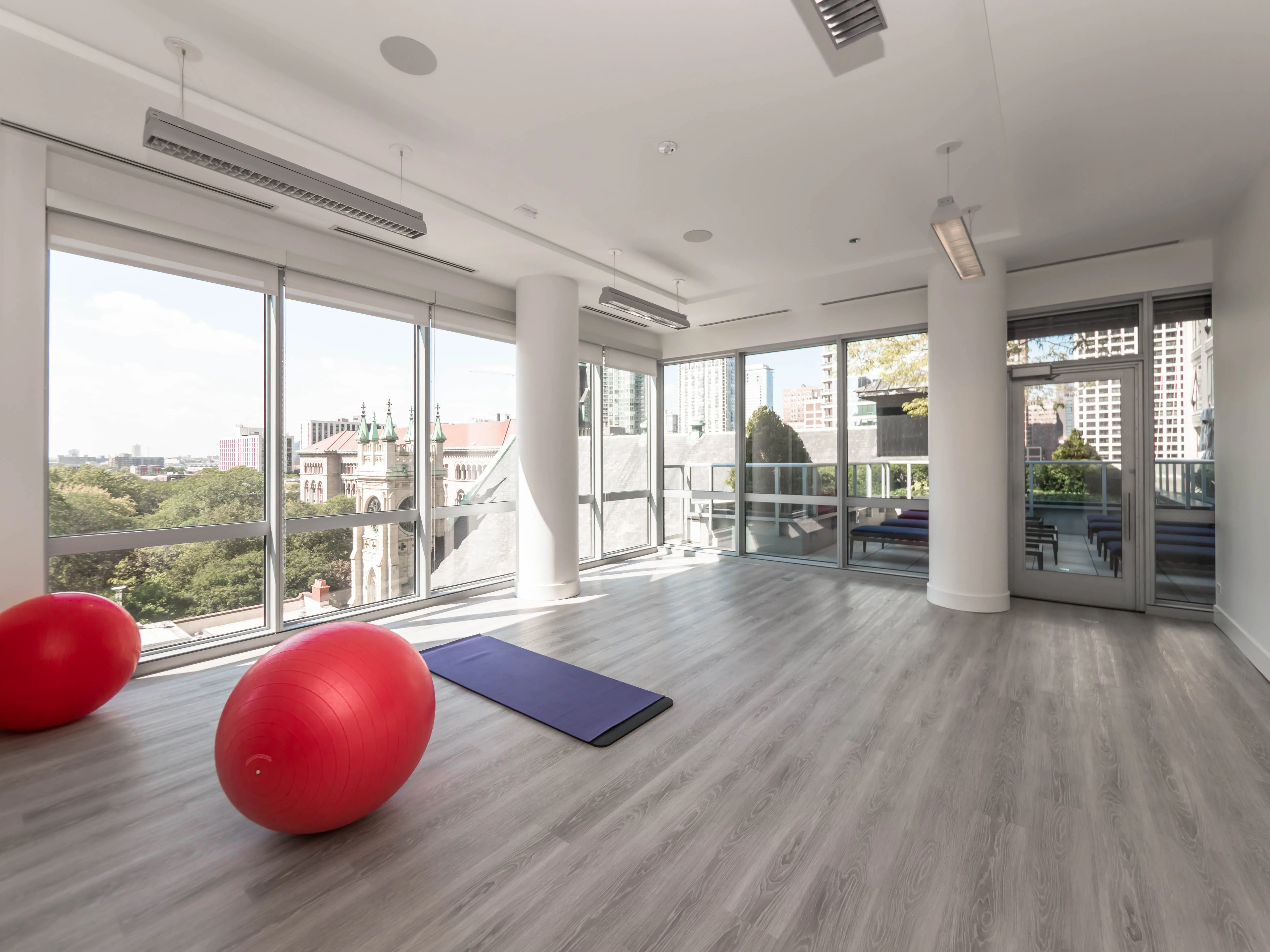model corner furnished living room at Two West Delaware Apartments