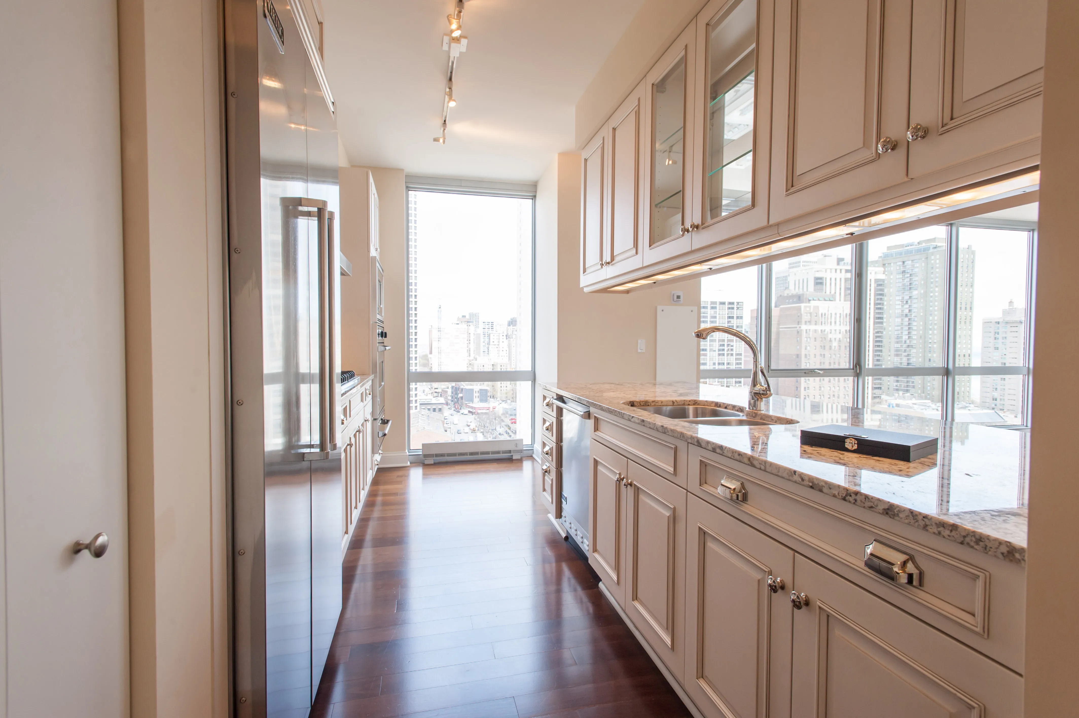 model corner furnished living room at Two West Delaware Apartments