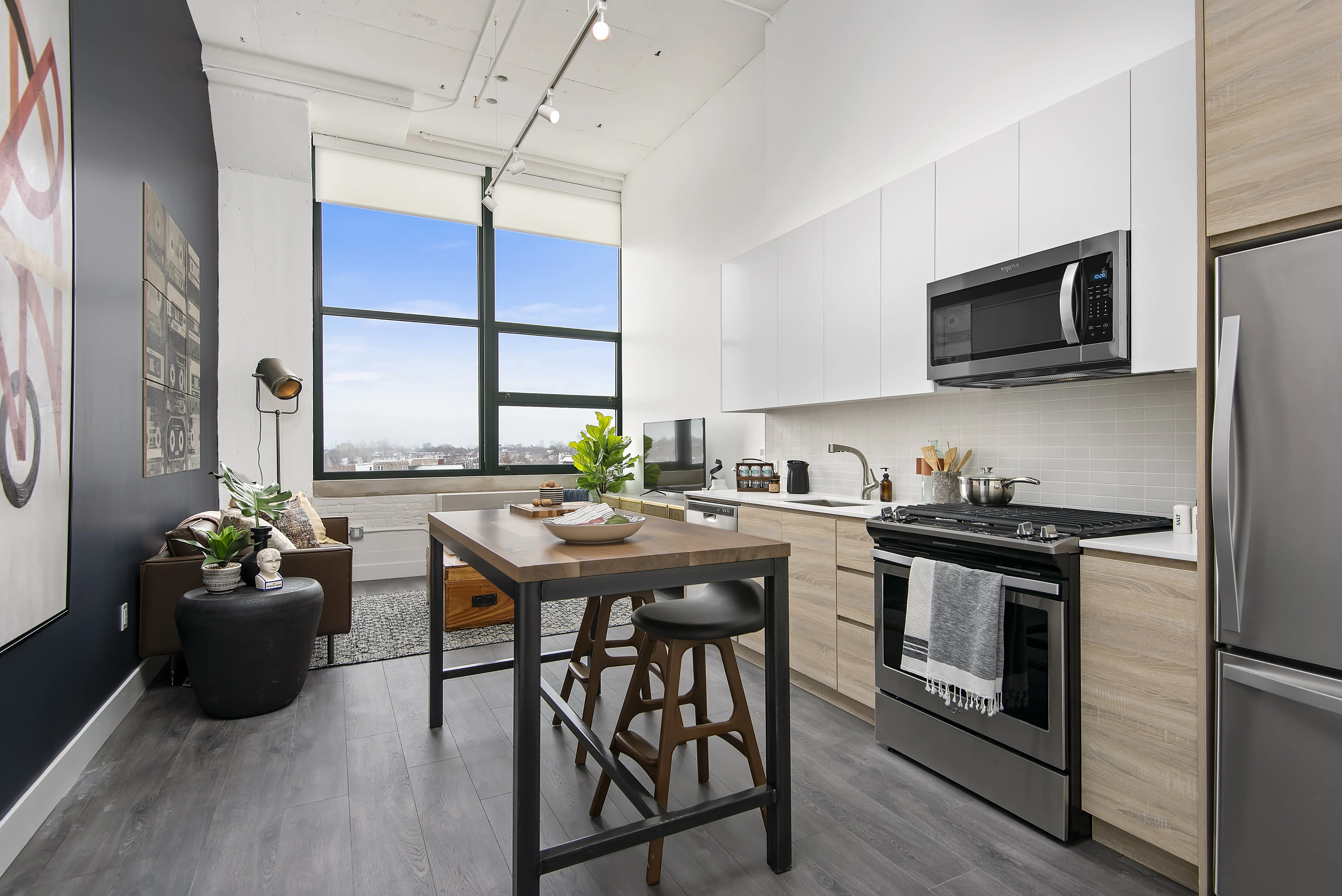 model kitchen, living room and view from Field's Loft Apartments in Chicago