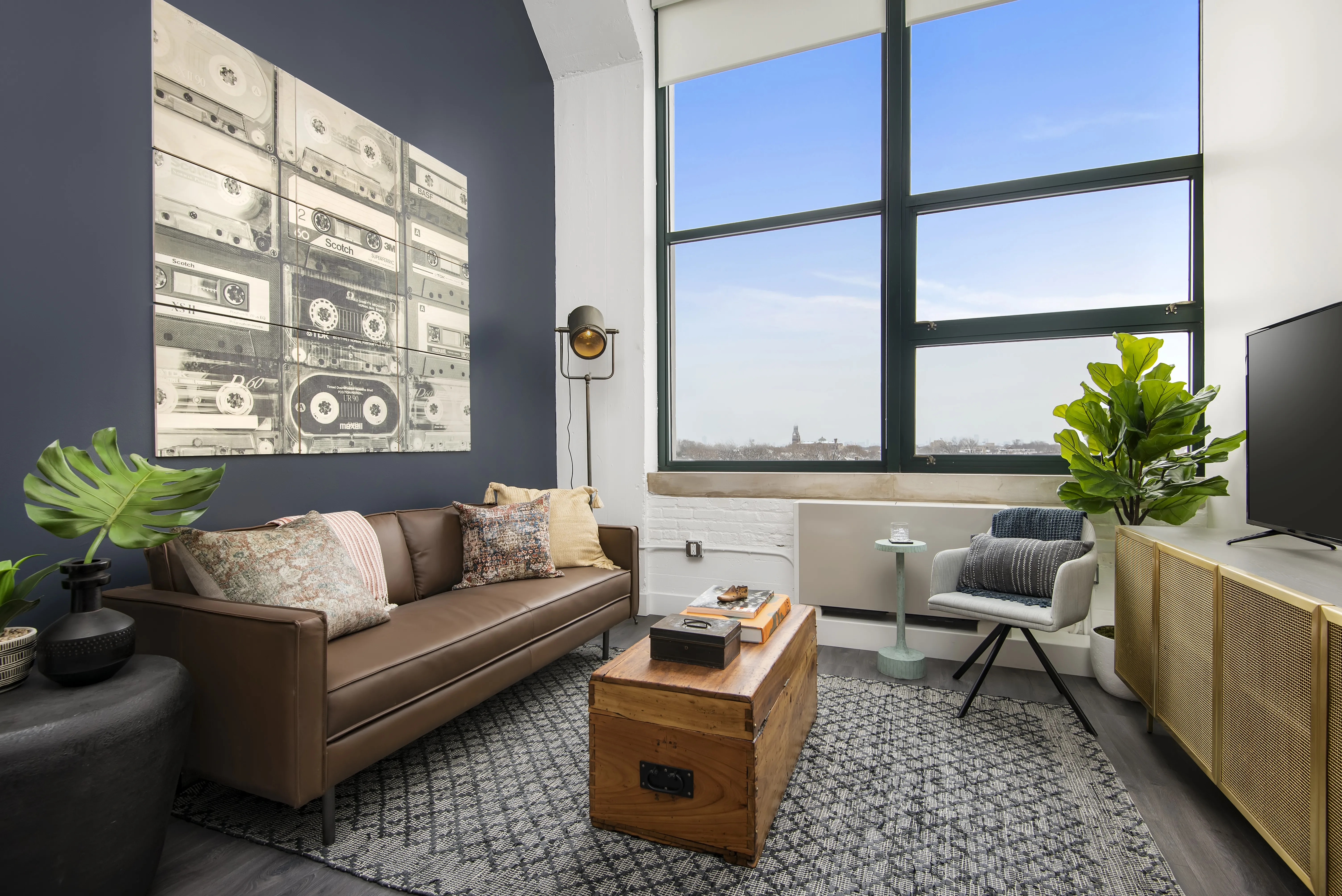 model kitchen, living room and view from Field's Loft Apartments in Chicago
