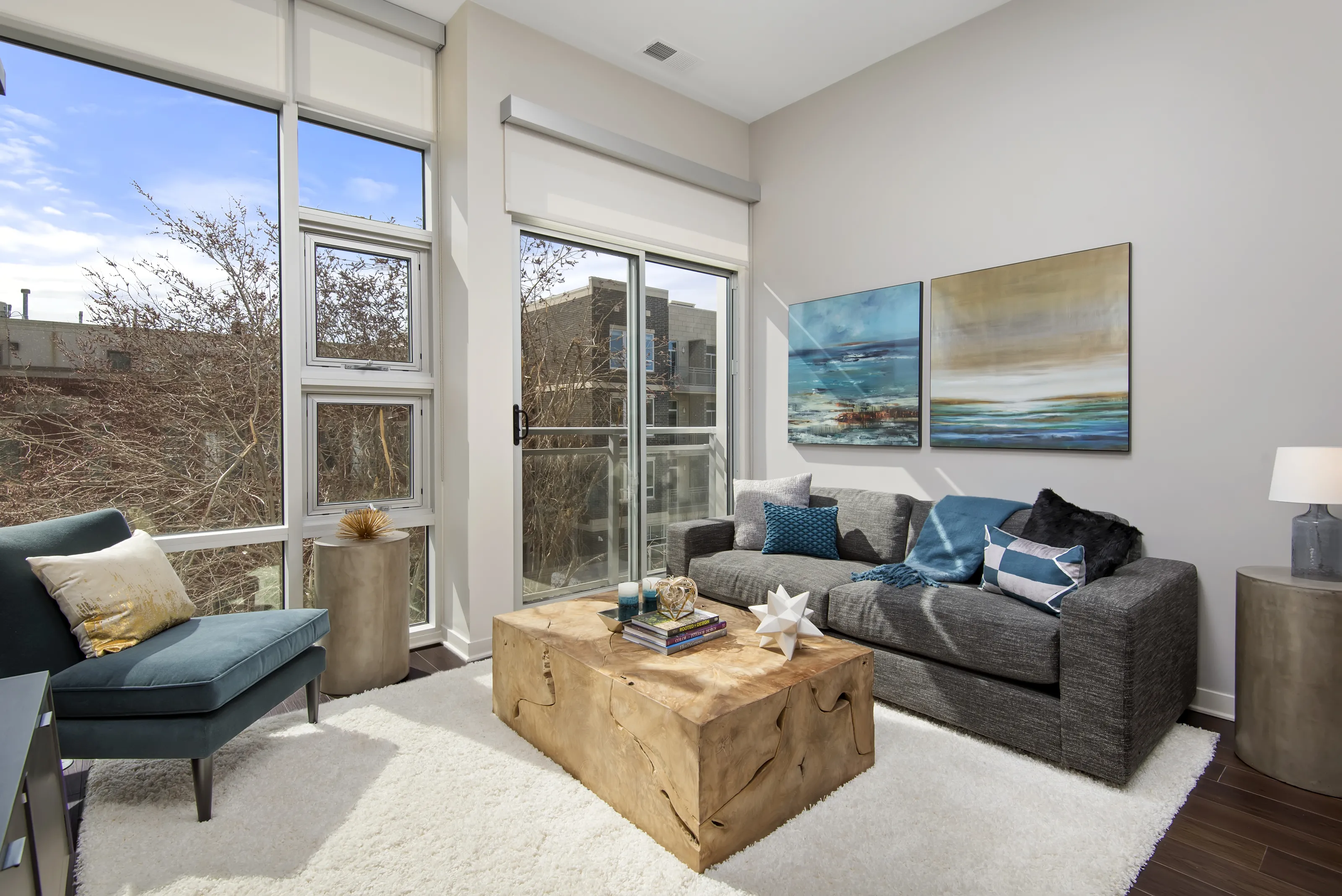 model living rooms with view at Luxe on Madison Apartments