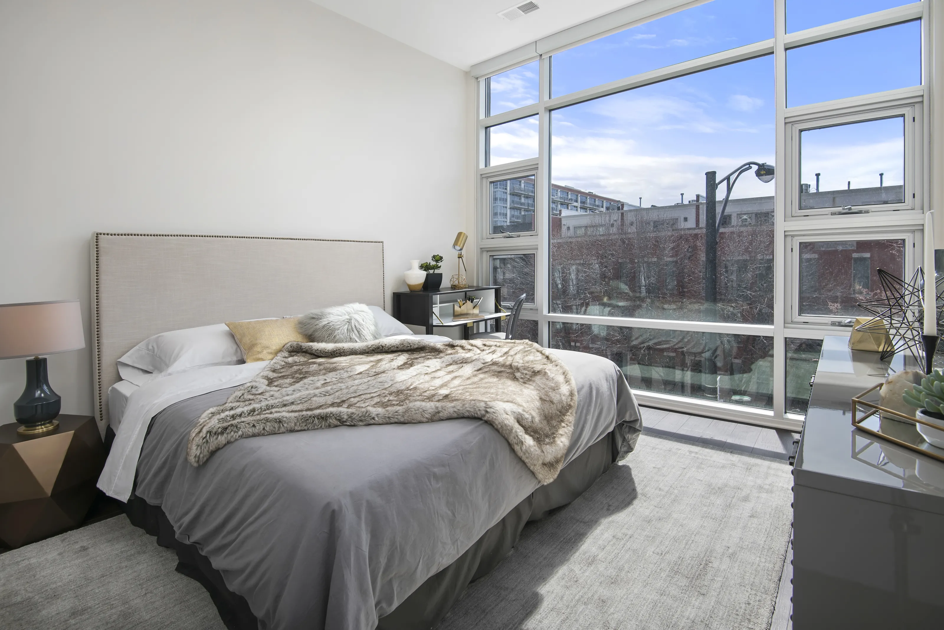 model living rooms with view at Luxe on Madison Apartments