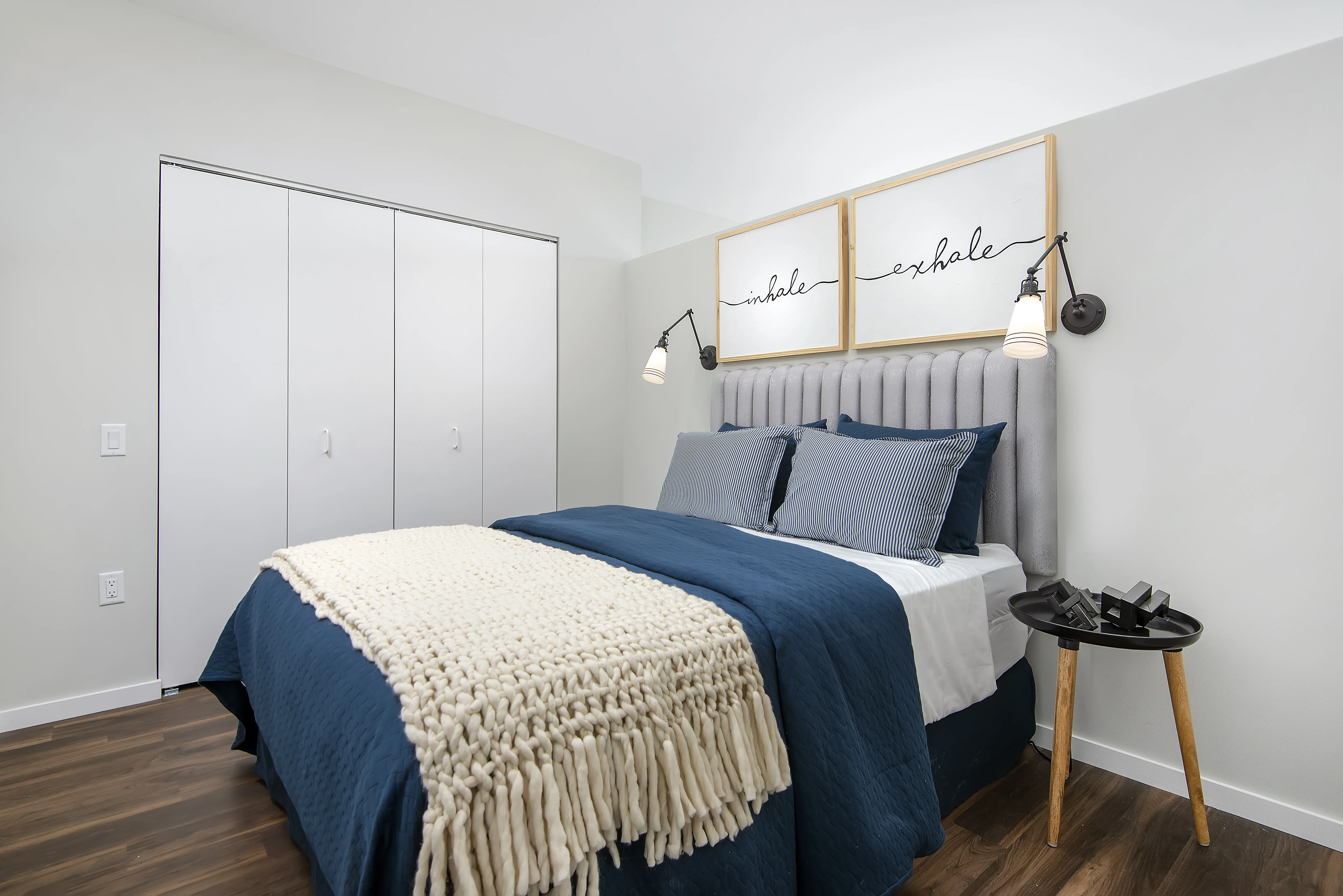 kitchen island, living area and view of the lake at Eleven40 Apartments