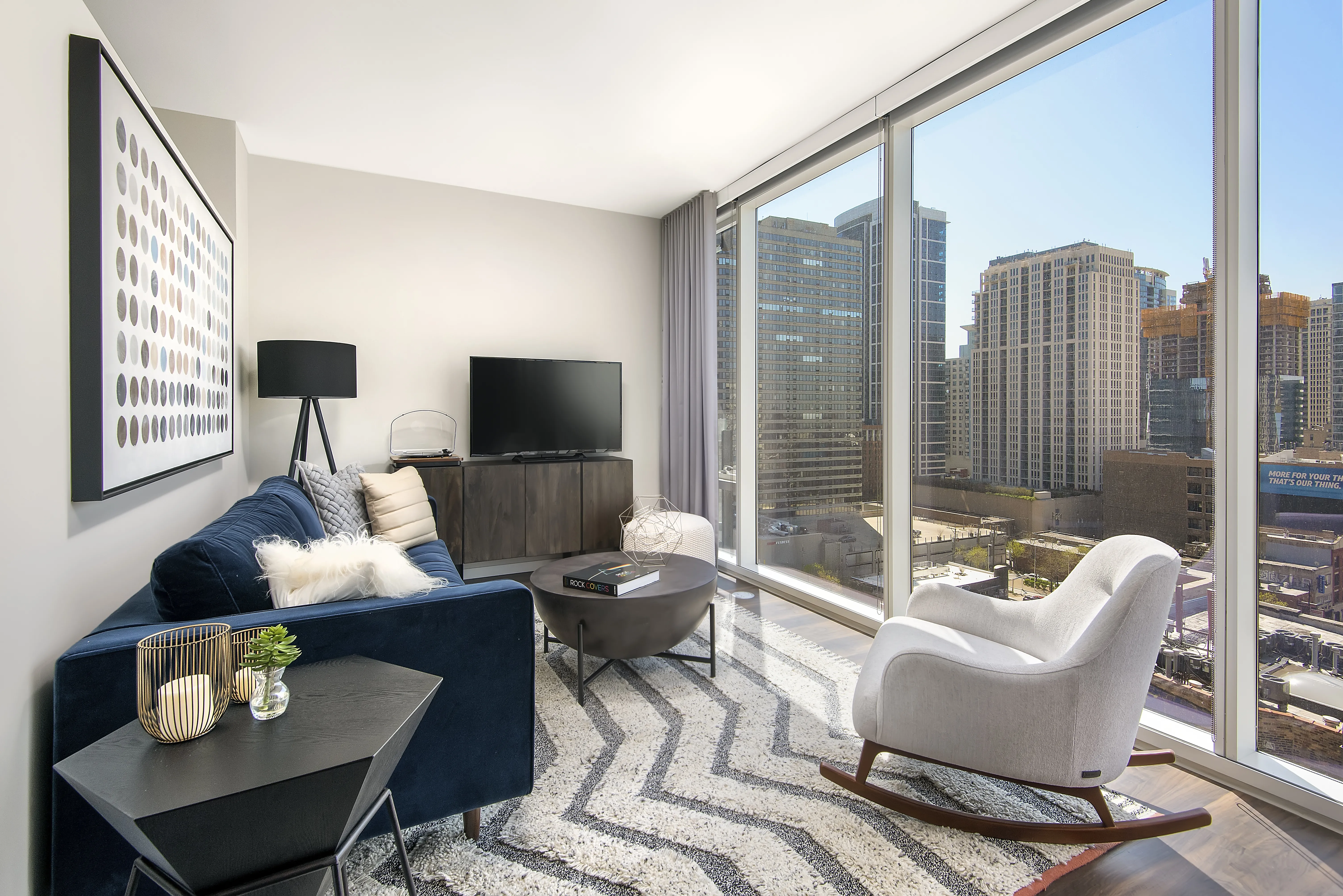 kitchen island, living area and view of the lake at Eleven40 Apartments