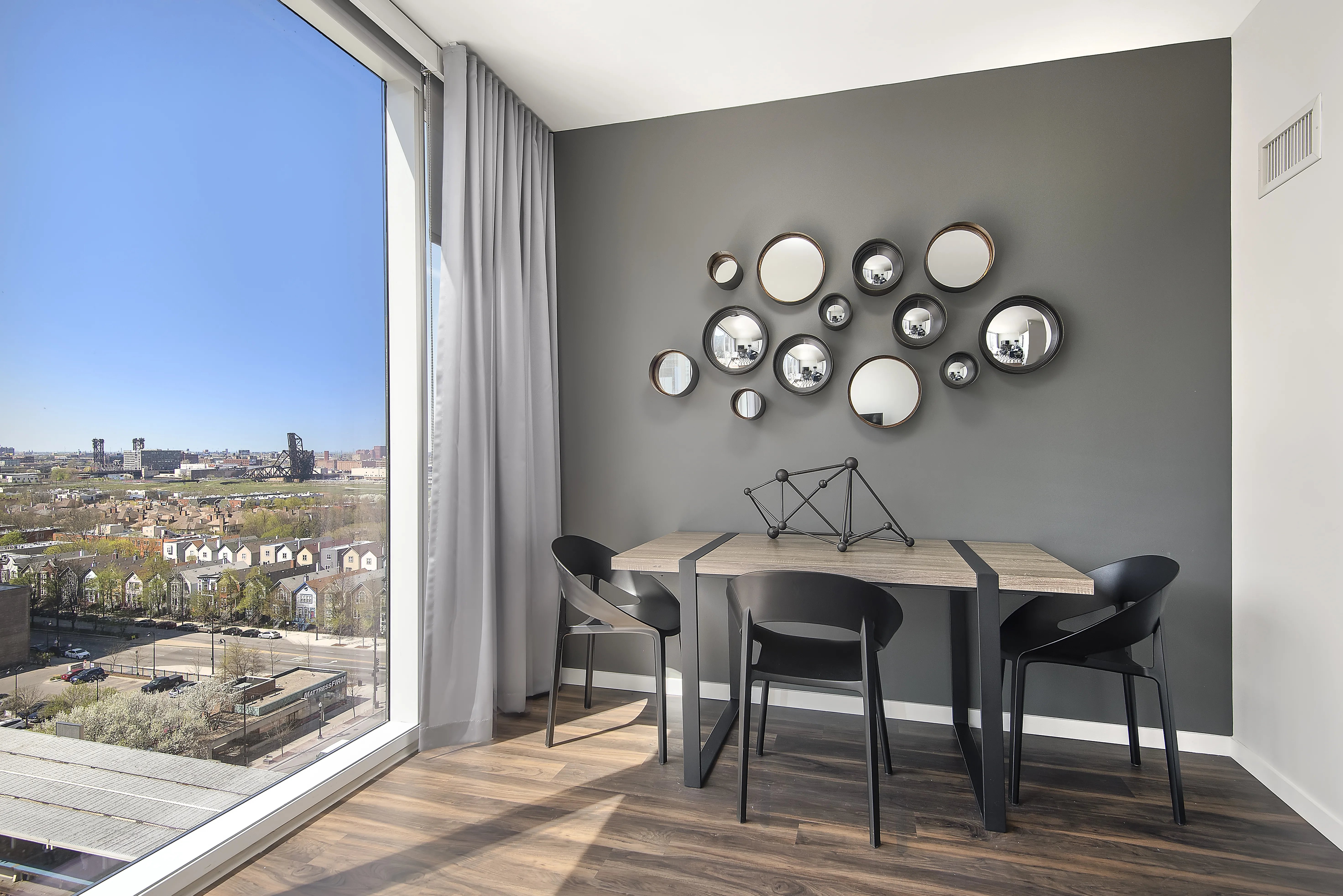kitchen island, living area and view of the lake at Eleven40 Apartments