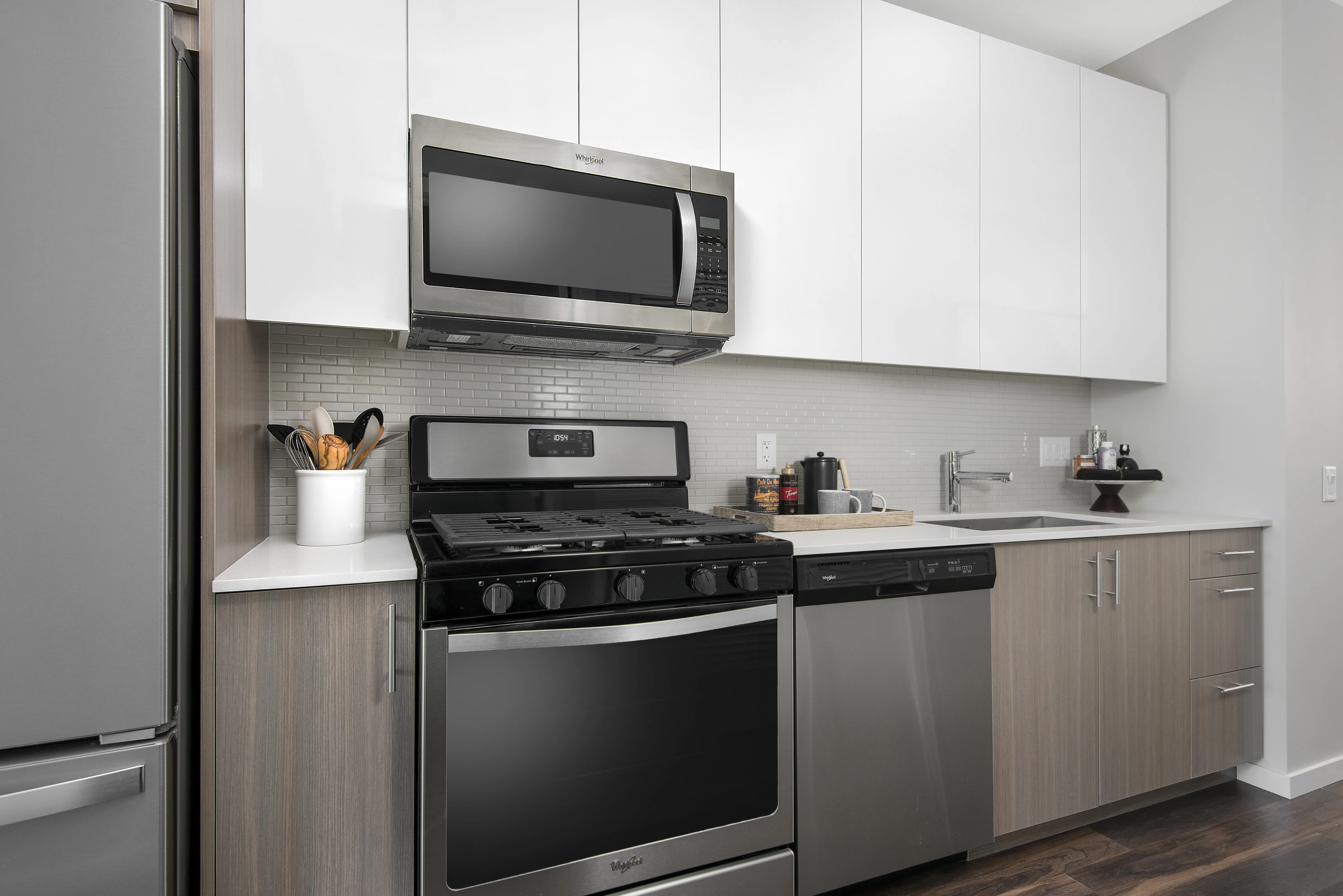 kitchen island, living area and view of the lake at Eleven40 Apartments