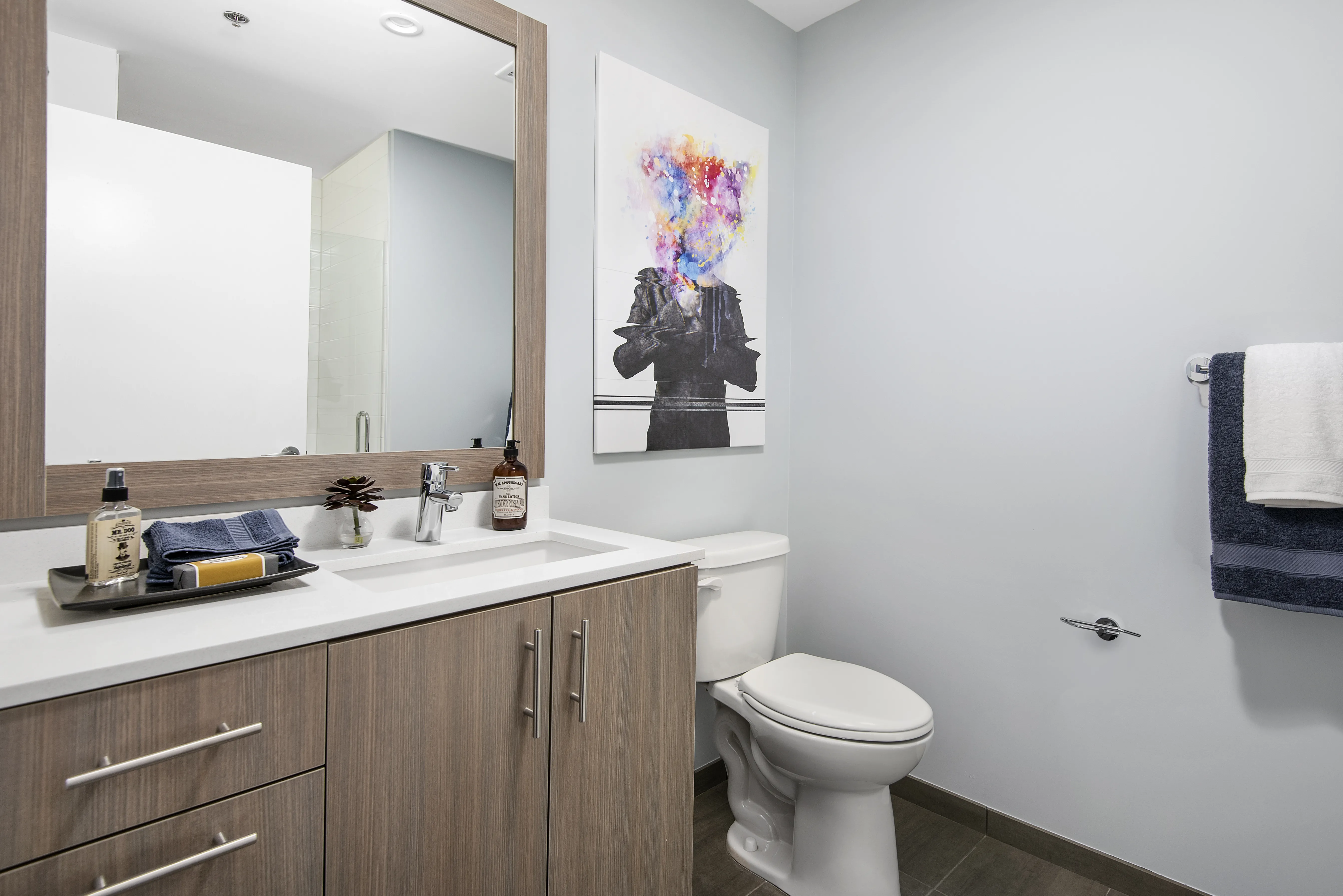 kitchen island, living area and view of the lake at Eleven40 Apartments