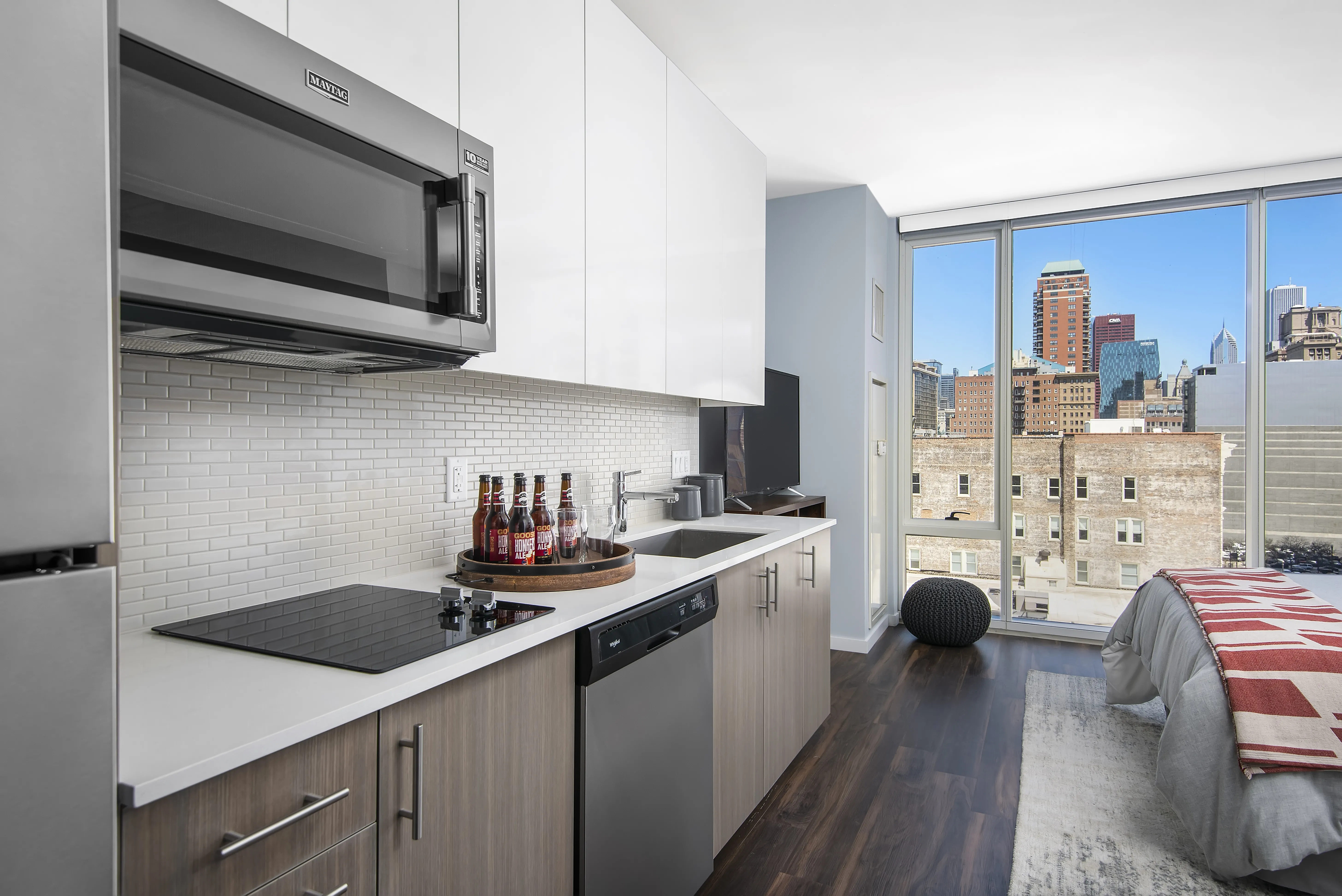 kitchen island, living area and view of the lake at Eleven40 Apartments