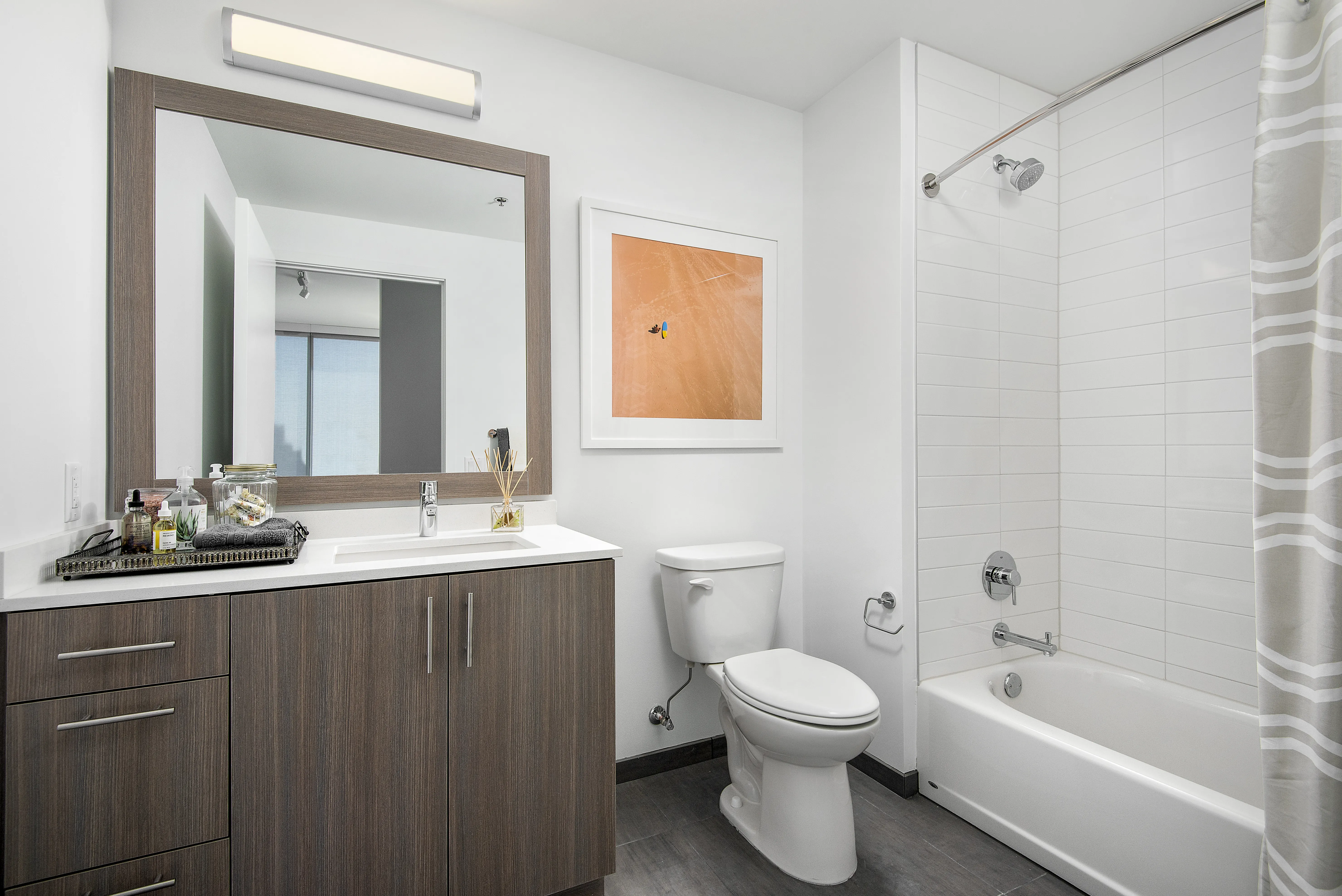kitchen island, living area and view of the lake at Eleven40 Apartments