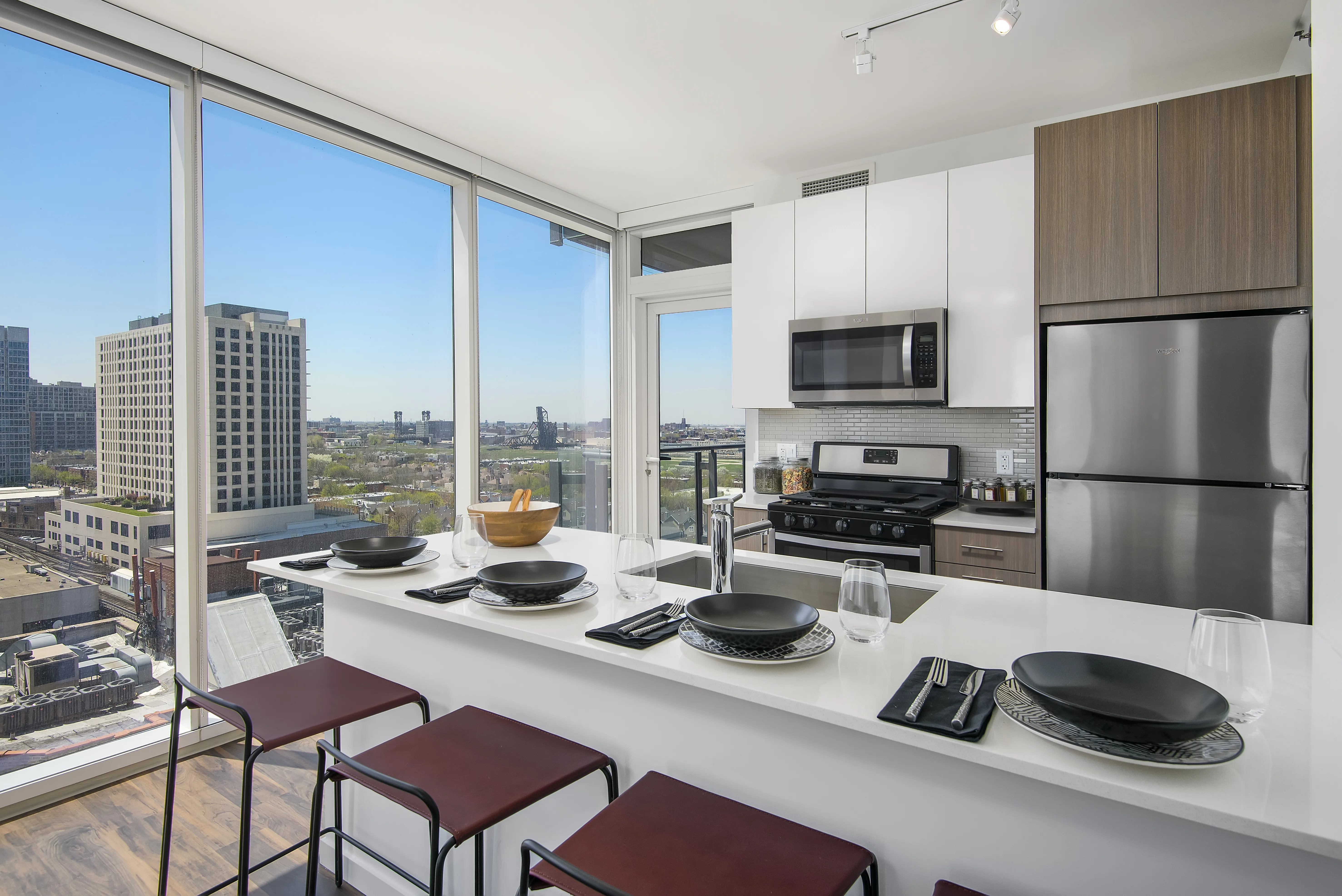kitchen island, living area and view of the lake at Eleven40 Apartments