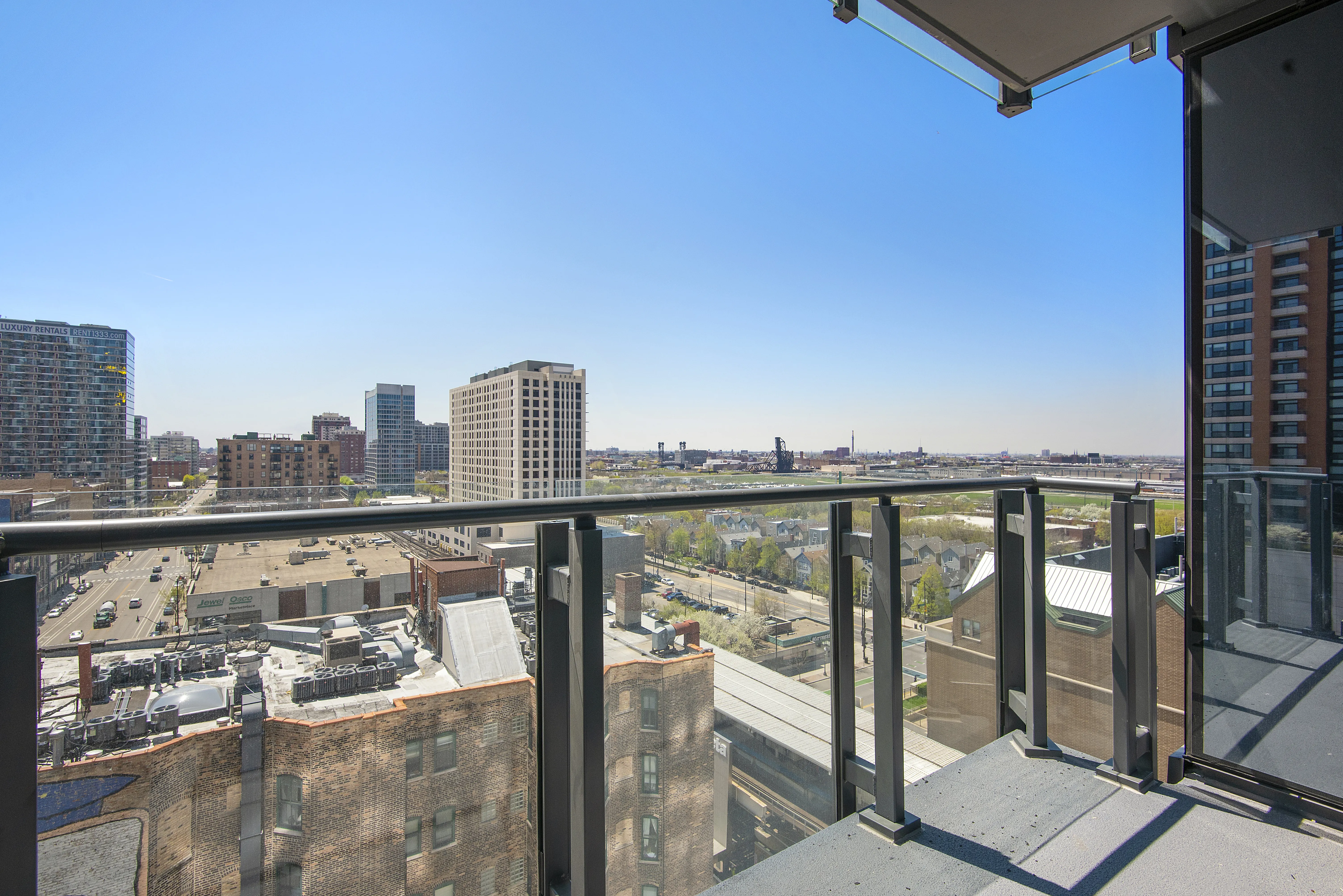 kitchen island, living area and view of the lake at Eleven40 Apartments