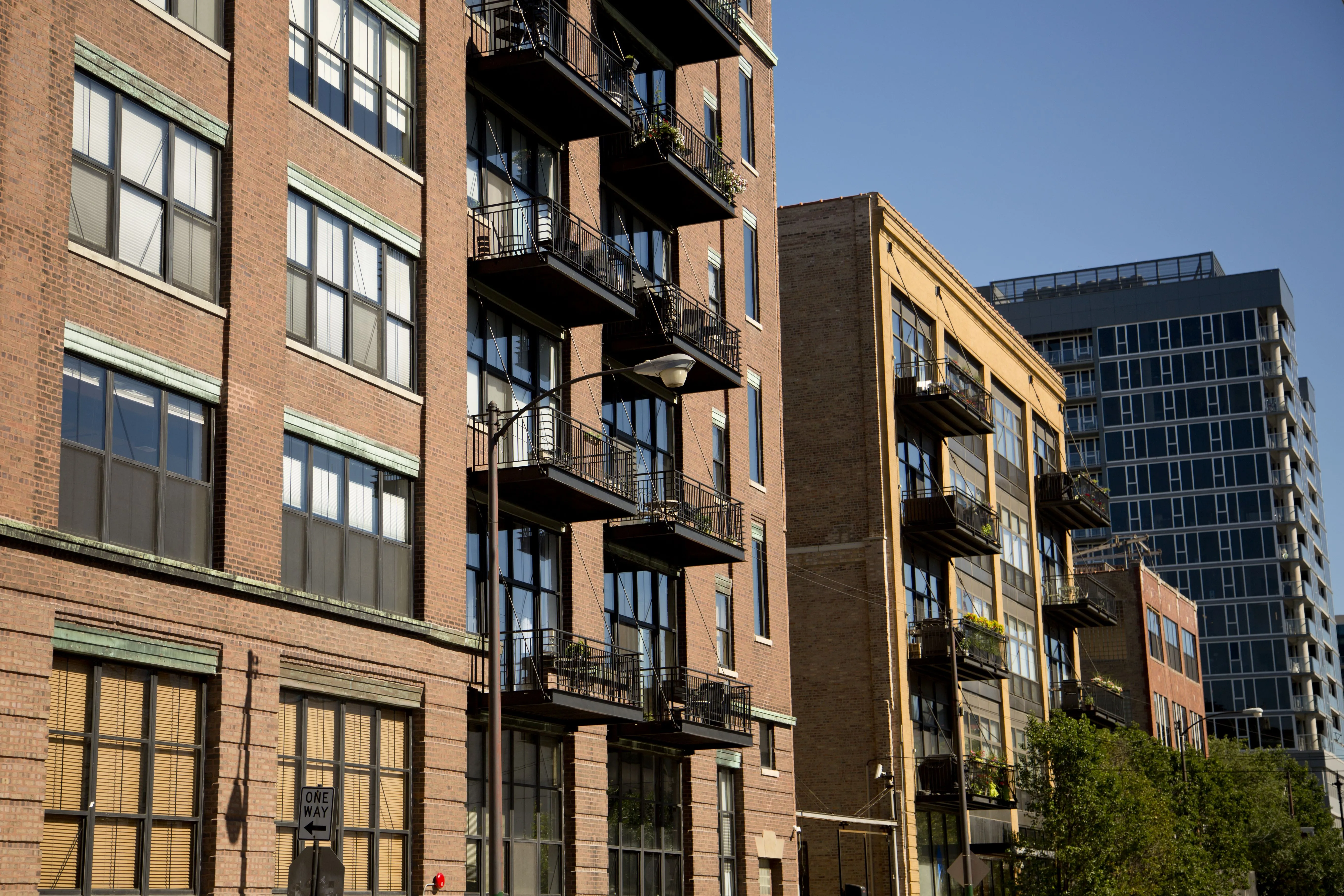 brick apartment building exterior with steel balconies in West Loop Chicago