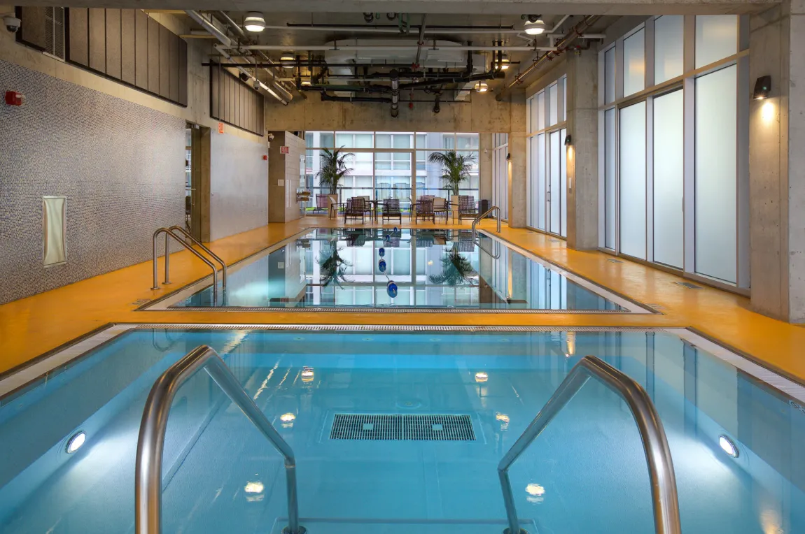 living room with wood floors and downtown view at Aston Chicago Apartments