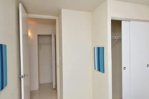 bedroom 2 closets and hallway