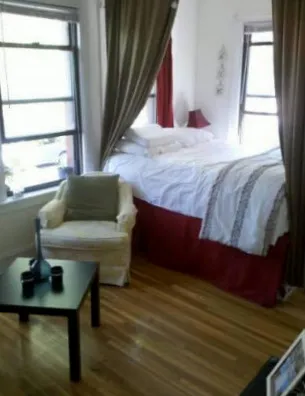 corner sreet view of red brick exterior of 815-823 West Bradley Apartments