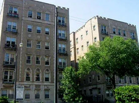 vintage building with courtyard and trees at The Renaissance Apartments