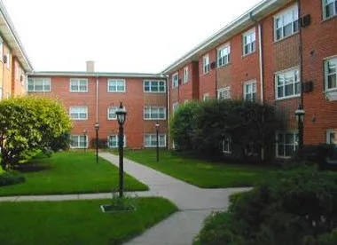 courtyard entrance with red brick building at 2349 West Jarvis Apartments