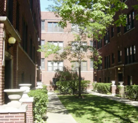 metal gate and landscaped courtyard at The Edward Apartments