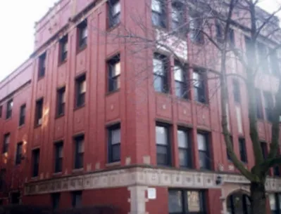 corner sreet view of red brick exterior of 815-823 West Bradley Apartments