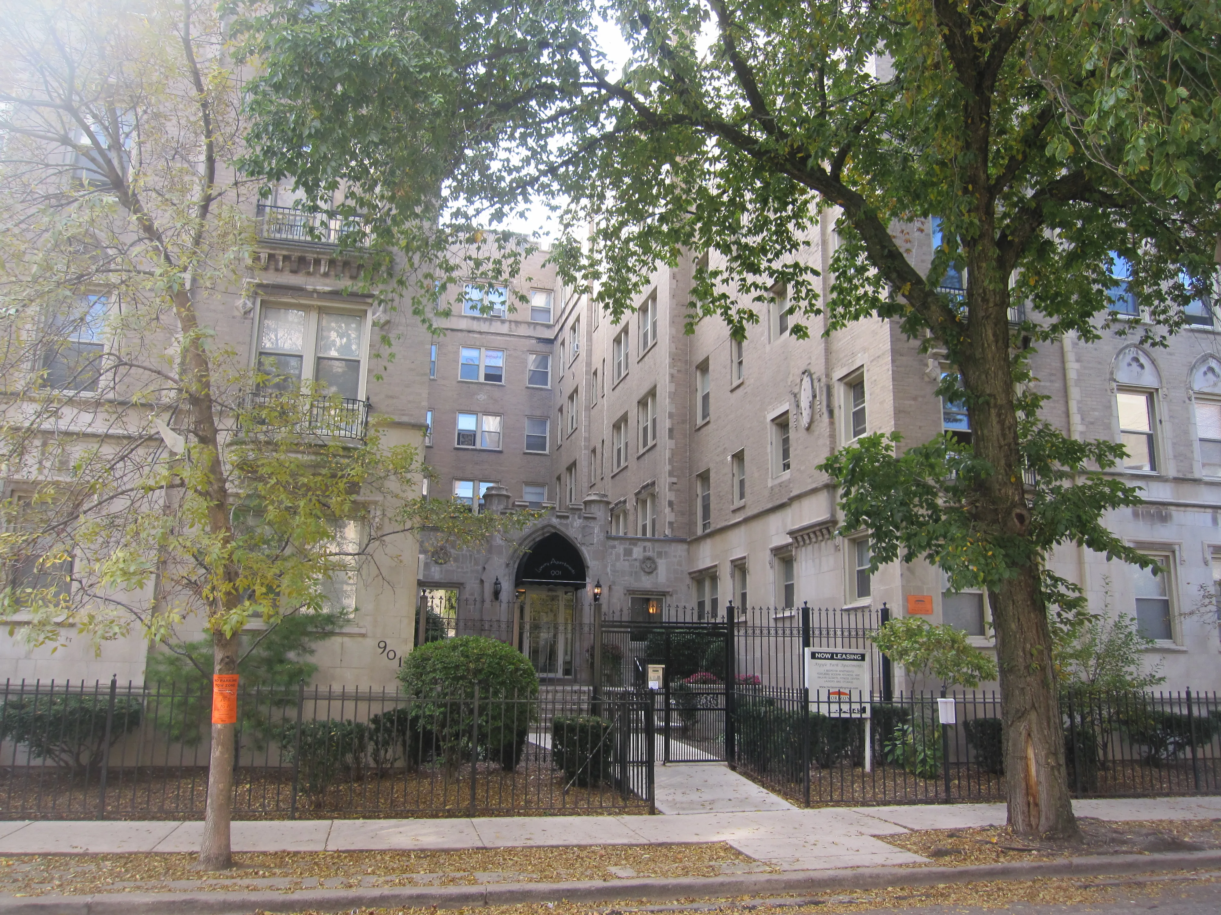 vintage building with courtyard and trees at The Renaissance Apartments