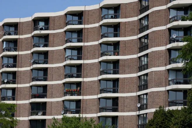 outdoor pool and building exterior at Atrium at Old Town Park Apartments