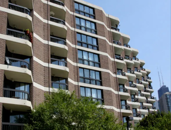 outdoor pool and building exterior at Atrium at Old Town Park Apartments