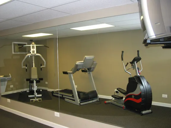 exterior of Sheridan Terrace Apartments with trees in front