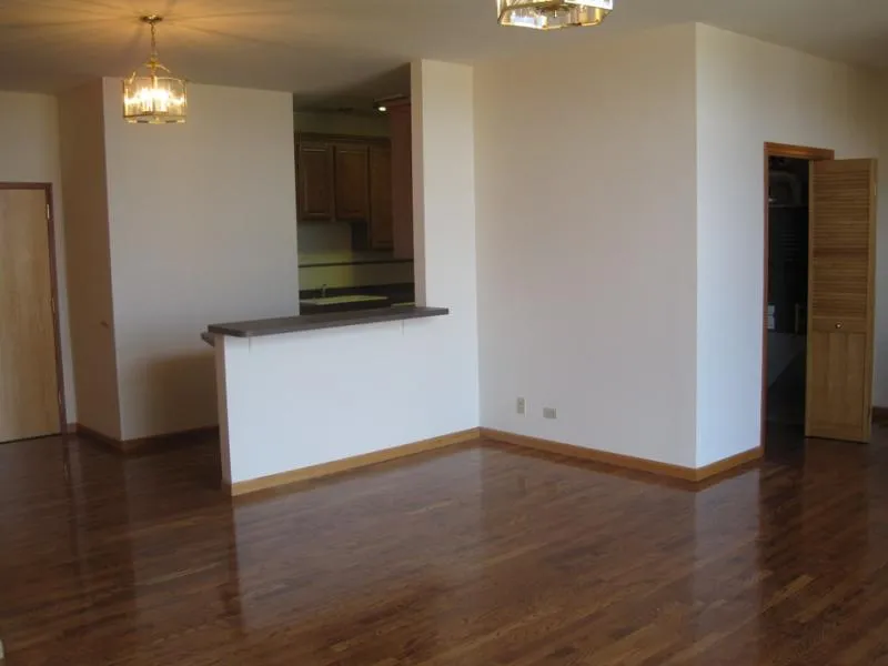 across the street with trees and cars at 2375 W Montana Apartments