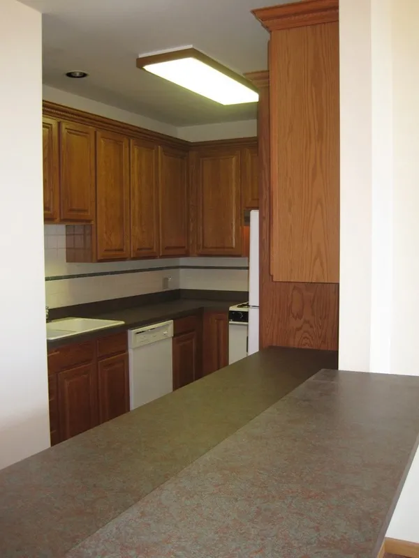 across the street with trees and cars at 2375 W Montana Apartments