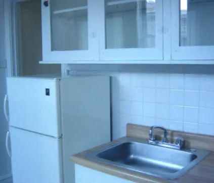 metal gate and landscaped courtyard at The Edward Apartments