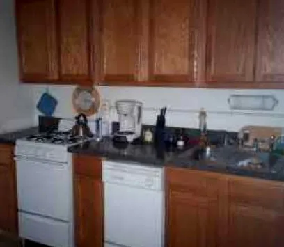 corner sreet view of red brick exterior of 815-823 West Bradley Apartments