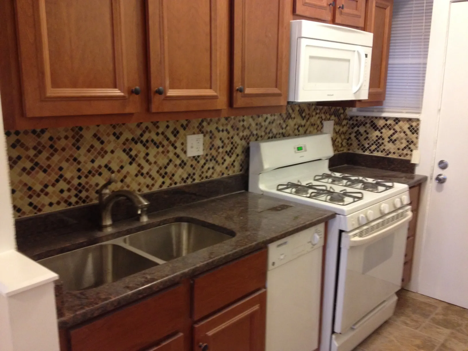 kitchen with all glass tile splash back