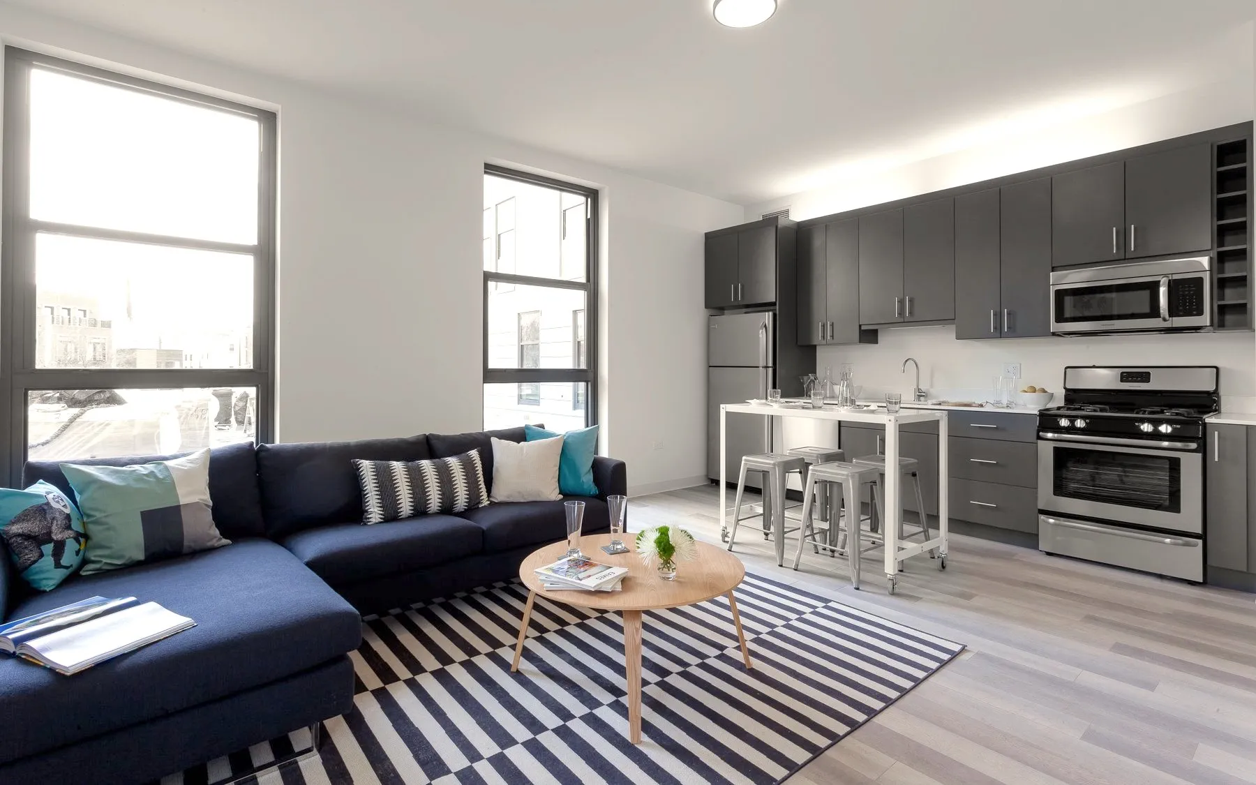 outdoor amenity area with El train car at L - Logan Square Apartments