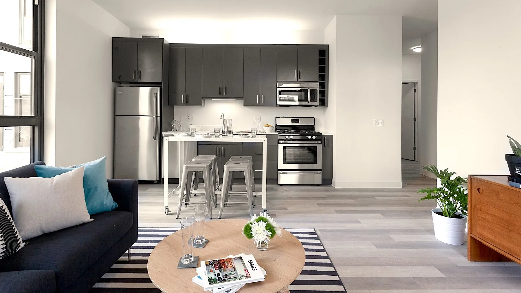 living room, breakfast area and kitchen at L Logan Apartments