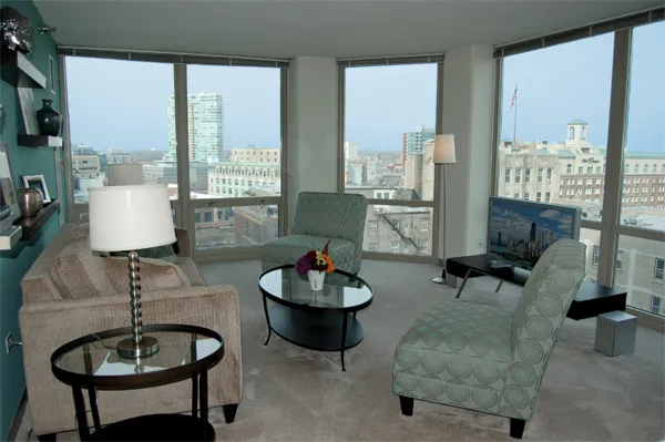 flowers surround the entrance of The Park Evanston Apartments in Evanston