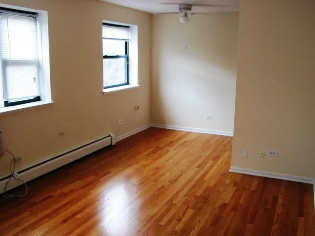 exterior of Sheridan Terrace Apartments with trees in front