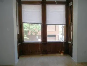 exterior red brick facade of vintage 814 N. State Apartments