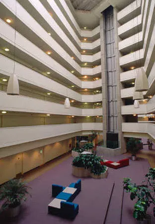 outdoor pool and building exterior at Atrium at Old Town Park Apartments