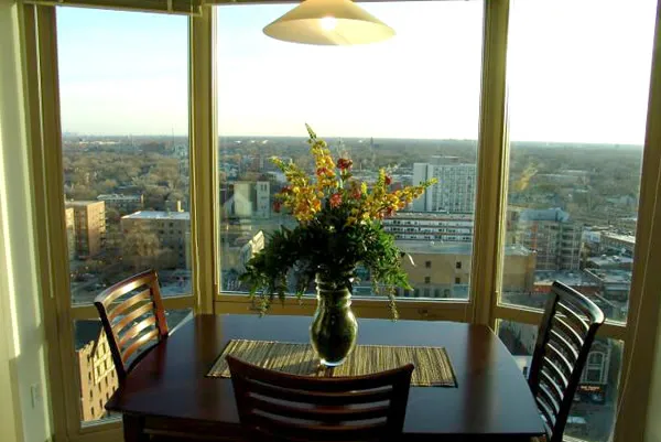 flowers surround the entrance of The Park Evanston Apartments in Evanston