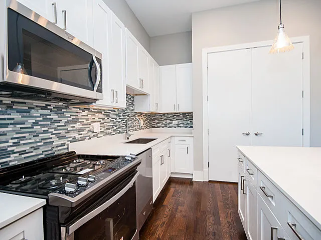 glass backsplash, dishwasher in all units at RavenLux Apartments