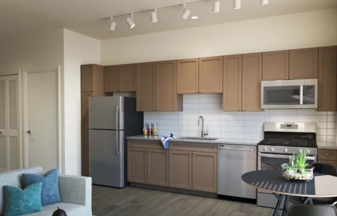 model kitchen with island at Linkt Apartments in River West