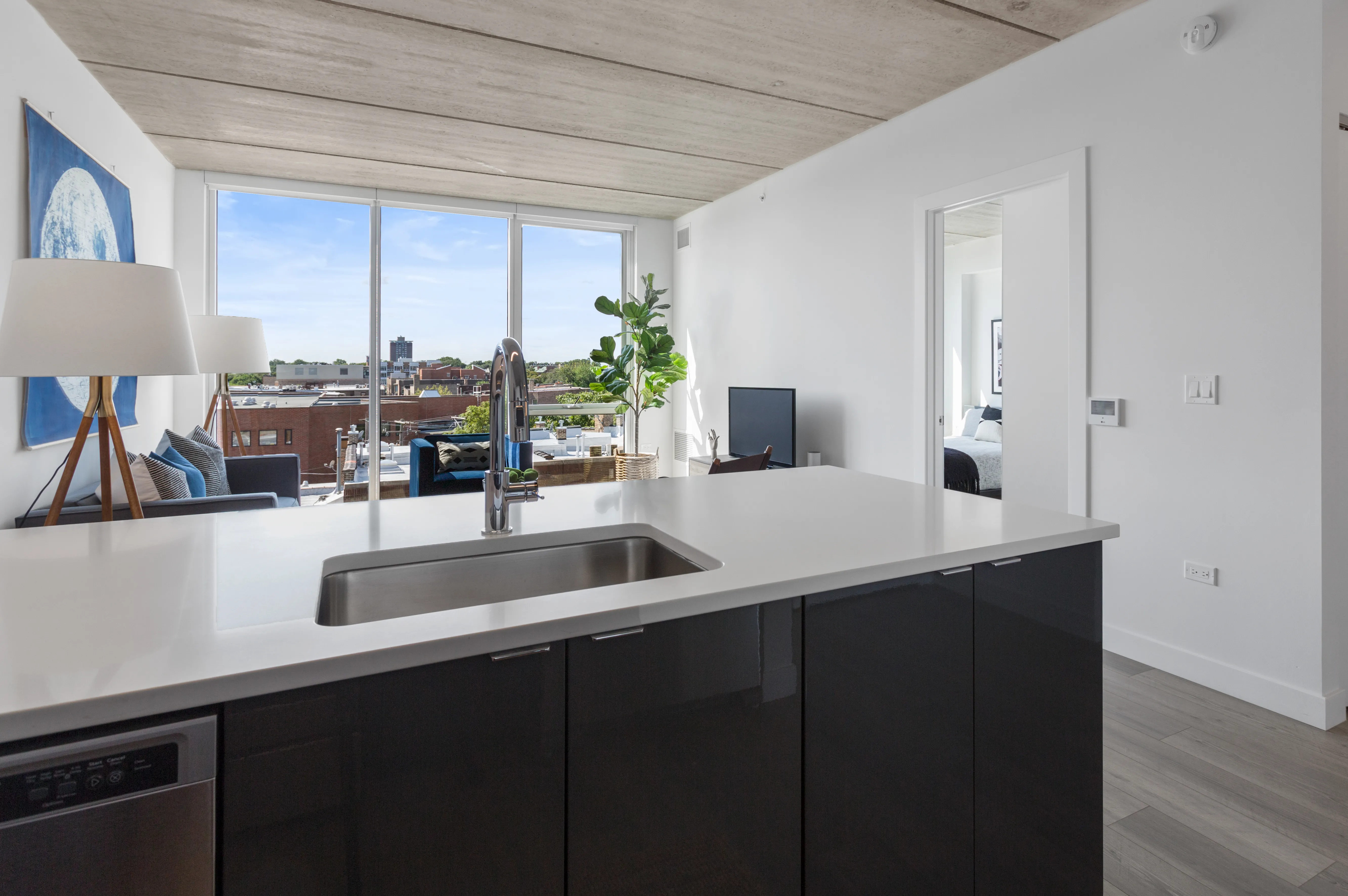 1 bedroom unit kitchen and living at Viridian on Sheridan Apartments