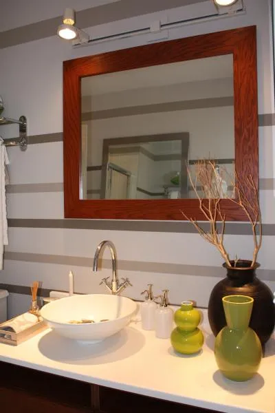 entrance to MDA City Club Apartments with red bench a flowers in pot