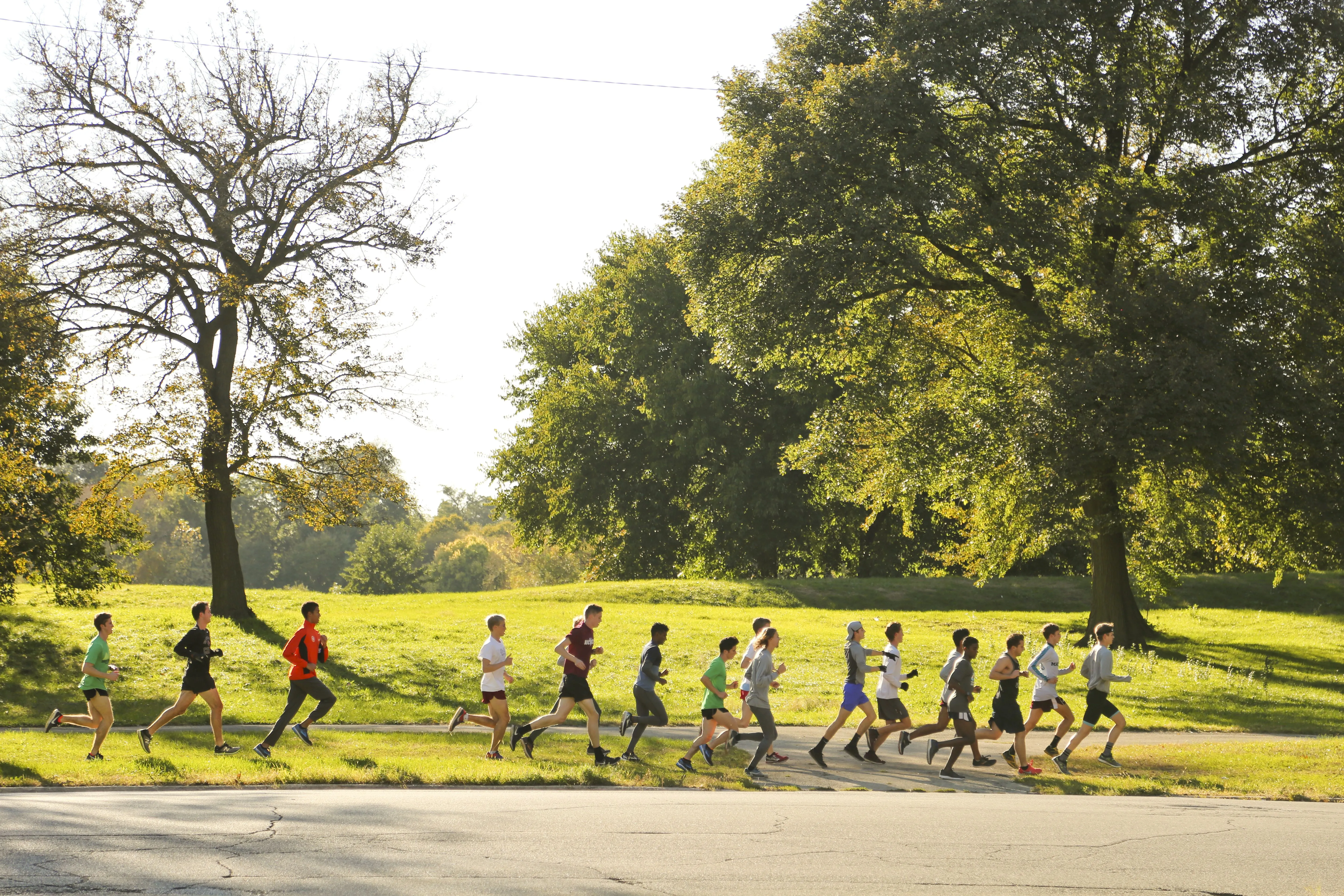 Cross country athletes jogging in the park in Washington Park Chicago